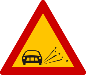 Loose chippings and stones on the road warning